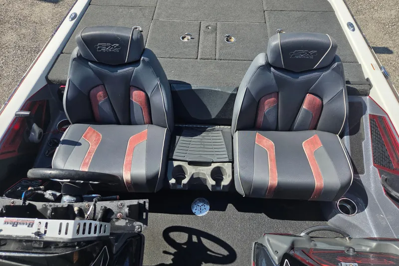 Slide: The Image of 2019 Skeeter FX21 Apex boat interior with dual seats and steering console. - 21