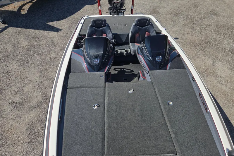 Slide: The Image of 2019 Skeeter FX21 Apex boat interior with dual seats and storage compartments. - 22