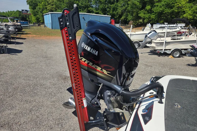 Slide: The Image of 2019 Skeeter FX21 Apex with Yamaha engine in a boatyard setting. - 4