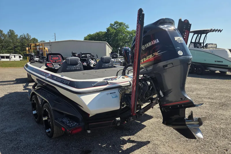 Slide: The Image of 2019 Skeeter FX21 Apex boat with Yamaha engine, parked outdoors. - 7