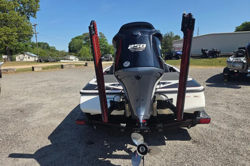 Slide: The Image of 2019 Skeeter FX21 Apex boat with powerful 250 horsepower engine, parked outdoors. - 8
