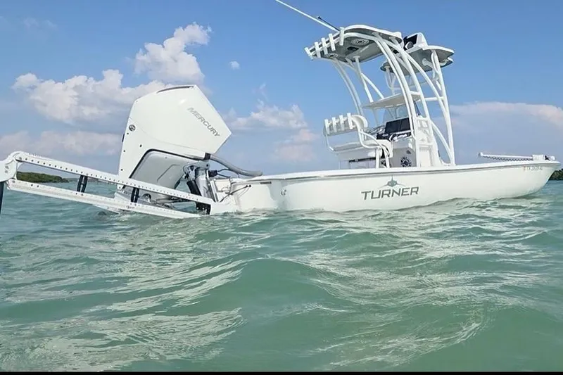 The Image of 2023 Turner Boatworks 2500VS on water, showcasing sleek design and Mercury engine. - 0