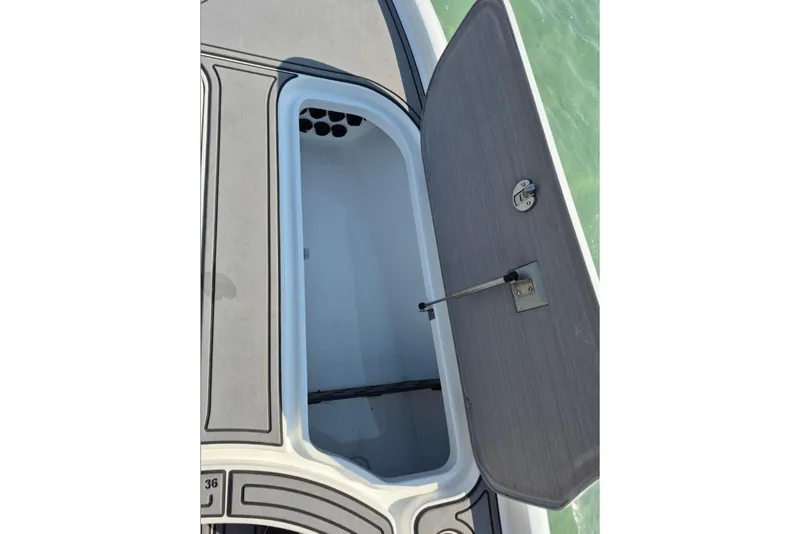 Slide: The Image of Open storage compartment on 2023 Turner Boatworks 2500VS, showcasing interior design. - 9