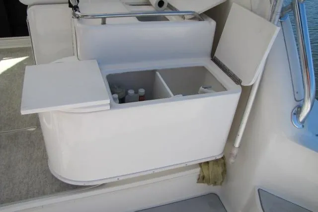 Slide: The Image of Open storage compartment on 1997 Sea Ray 370 Express Cruiser boat deck. - 10