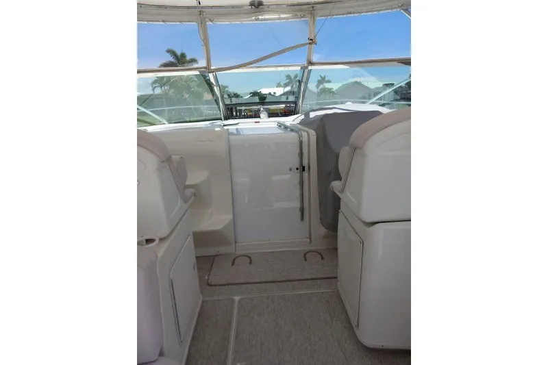 Slide: The Image of Interior view of a 1997 Sea Ray 370 Express Cruiser, showcasing seating and helm area. - 15