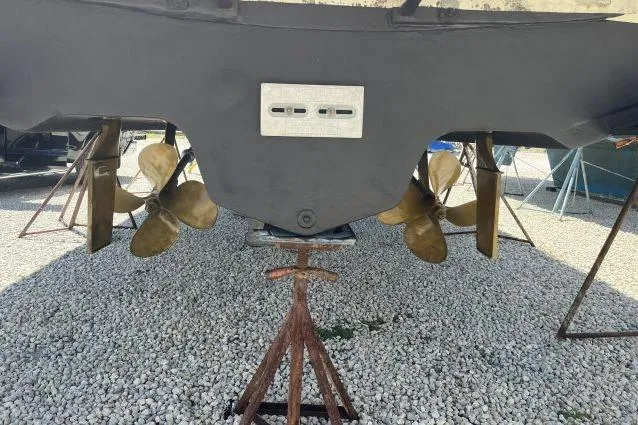 Slide: The Image of 1997 Sea Ray 370 Express Cruiser on stands, under clear blue sky. - 48