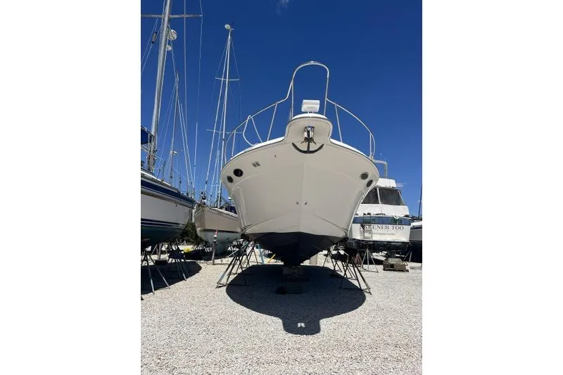 Slide: The Image of Underneath view of a 1997 Sea Ray 370 Express Cruiser with visible propeller and rudder. - 49