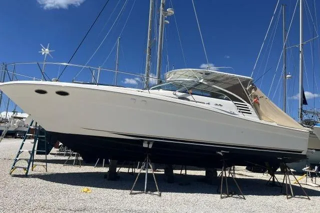 Slide: The Image of 1997 Sea Ray 370 Express Cruiser propellers and hull on stands. - 50