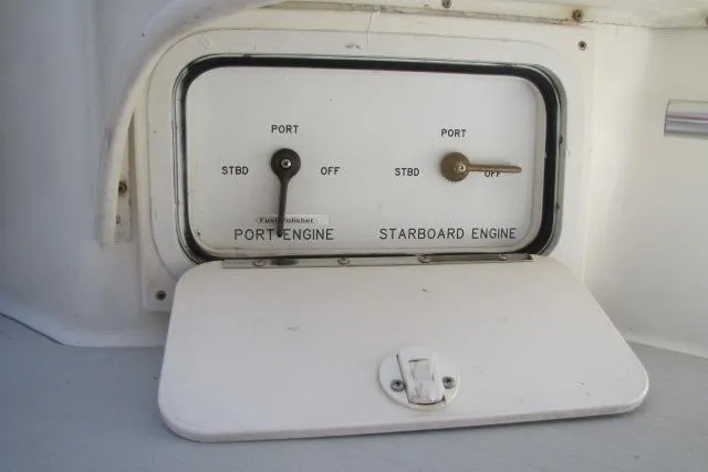 Slide: The Image of Engine room of a 1997 Sea Ray 370 Express Cruiser with visible components and wiring. - 59