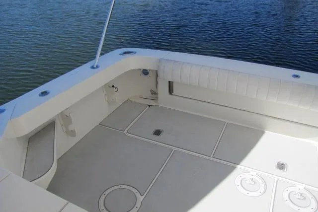 Slide: The Image of 1997 Sea Ray 370 Express Cruiser deck with seating and storage compartments. - 7