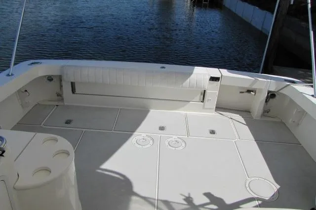 Slide: The Image of 1997 Sea Ray 370 Express Cruiser deck, spacious and well-maintained, overlooking calm waters. - 8