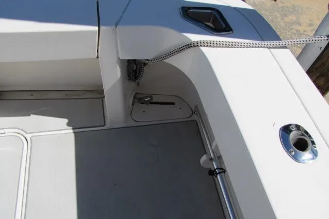 Slide: The Image of 1997 Sea Ray 370 Express Cruiser deck with storage compartments and equipment. - 9