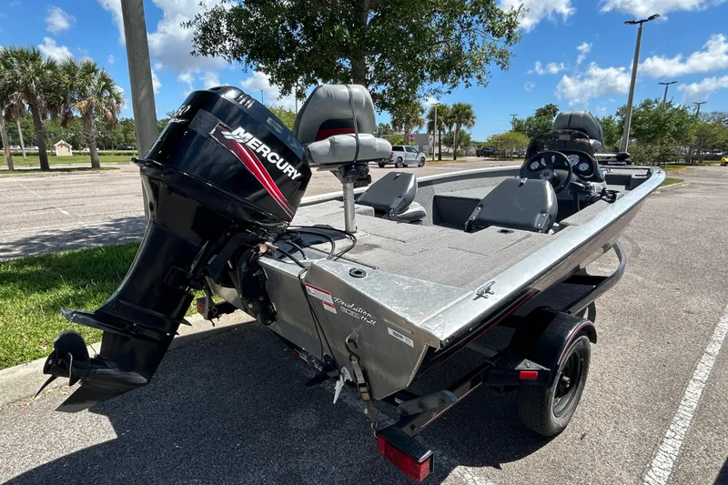 Slide: The Image of 2010 Tracker Pro Crappie 175 boat with Mercury engine in parking lot. - 3