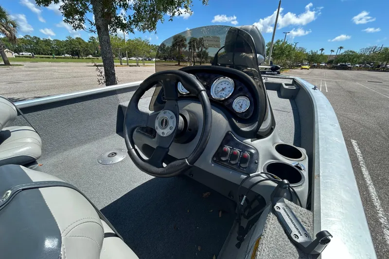 Slide: The Image of 2010 Tracker Pro Crappie 175 boat interior with steering wheel and dashboard controls. - 8