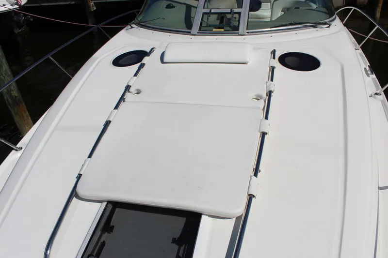 Slide: The Image of Cockpit view of a 2005 Sea Ray Sundancer 320, featuring navigation instruments and steering wheel. - 10