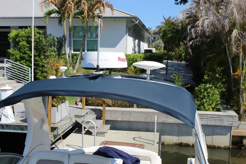 Slide: The Image of Bow of 2005 Sea Ray Sundancer 320 yacht on calm water. - 13