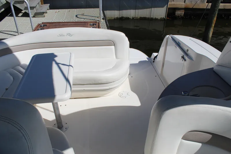 Slide: The Image of 2005 Sea Ray Sundancer 320 cockpit with dual seats and control panel. - 19