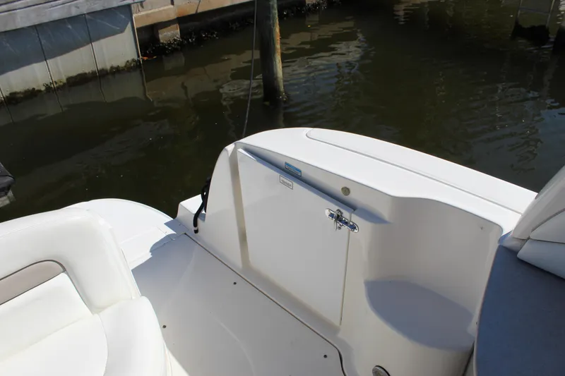 Slide: The Image of 2005 Sea Ray Sundancer 320 boat interior with cushioned seating and speaker system. - 21