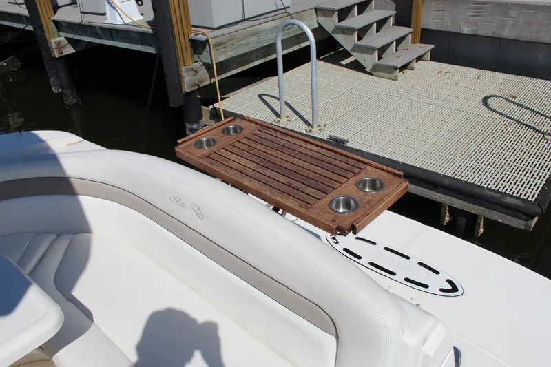 Slide: The Image of 2005 Sea Ray Sundancer 320 boat canopy and speaker with tropical background. - 22