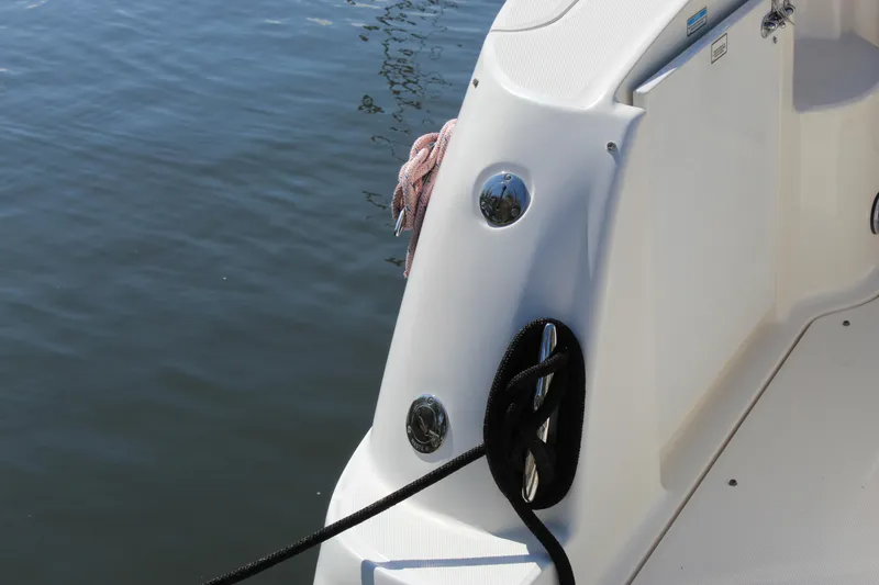 Slide: The Image of 2005 Sea Ray Sundancer 320 docked at a marina, showcasing its spacious deck and sleek design. - 25