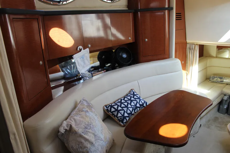 Slide: The Image of Interior of 2005 Sea Ray Sundancer 320 yacht with elegant seating and wooden cabinetry. - 35