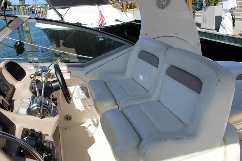 Slide: The Image of Helm of 2005 Sea Ray Sundancer 320 with steering wheel and navigation controls. - 6