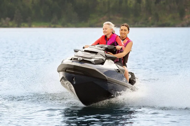 Slide: The Image of Manufacturer Provided Image: Two people riding a 2023 Sea-Doo GTX Limited 300 on a lake. - 4