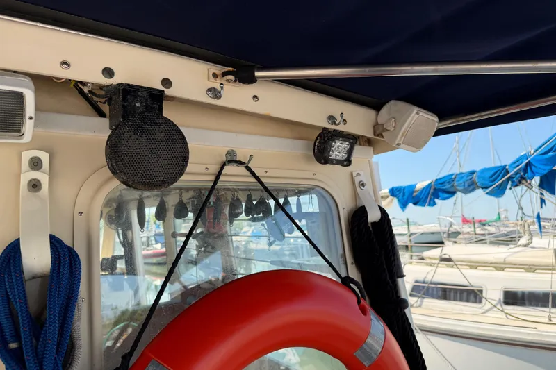 Slide: The Image of 1998 Rosborough RF-246 Sedan Cruiser with life preserver and nautical equipment. - 10