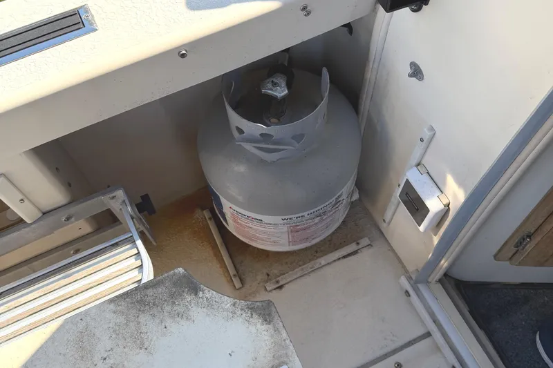 Slide: The Image of Propane tank storage area on a 1998 Rosborough RF-246 Sedan Cruiser boat. - 13