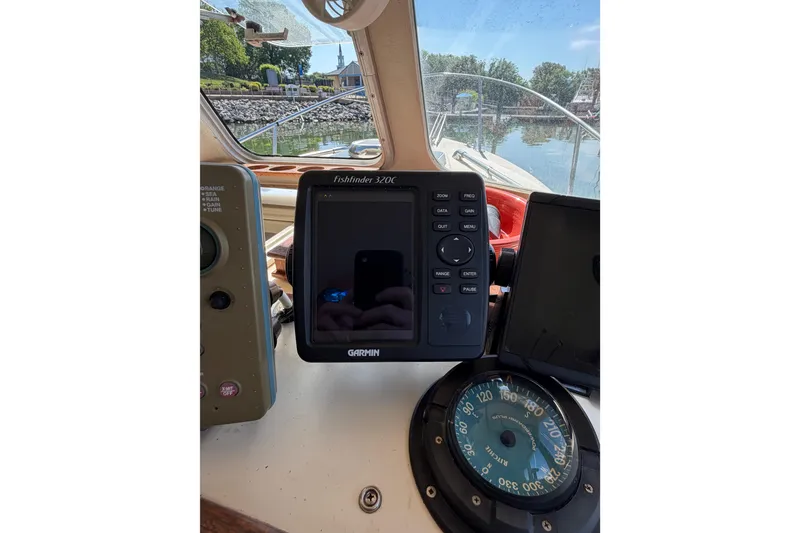 Slide: The Image of 1998 Rosborough RF-246 Sedan Cruiser dashboard with Garmin Fishfinder 320C and compass. - 21
