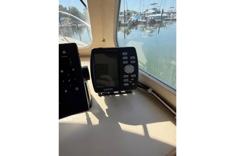 Slide: The Image of Garmin GPS device inside 1998 Rosborough RF-246 Sedan Cruiser, docked at marina. - 22