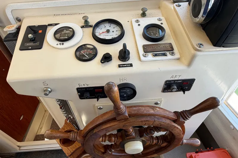Slide: The Image of Control panel of a 1998 Rosborough RF-246 Sedan Cruiser with gauges and wooden steering wheel. - 23
