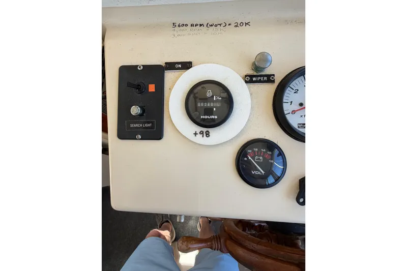 Slide: The Image of Control panel of a 1998 Rosborough RF-246 Sedan Cruiser with gauges and switches. - 24