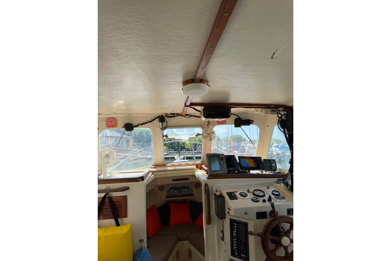 Slide: The Image of Interior view of 1998 Rosborough RF-246 Sedan Cruiser with navigation equipment and seating. - 27