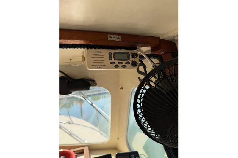 Slide: The Image of Interior of 1998 Rosborough RF-246 Sedan Cruiser with marine radio and fan. - 39