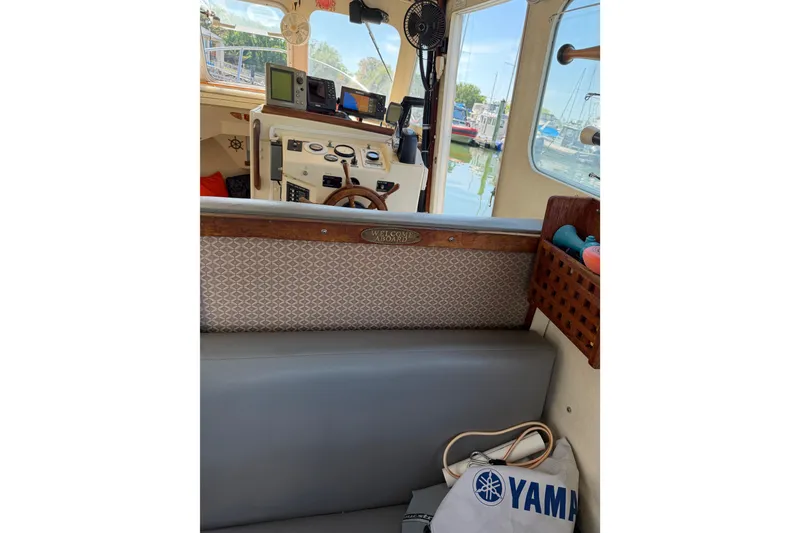 Slide: The Image of Interior of 1998 Rosborough RF-246 Sedan Cruiser with helm, seating, and nautical decor. - 42