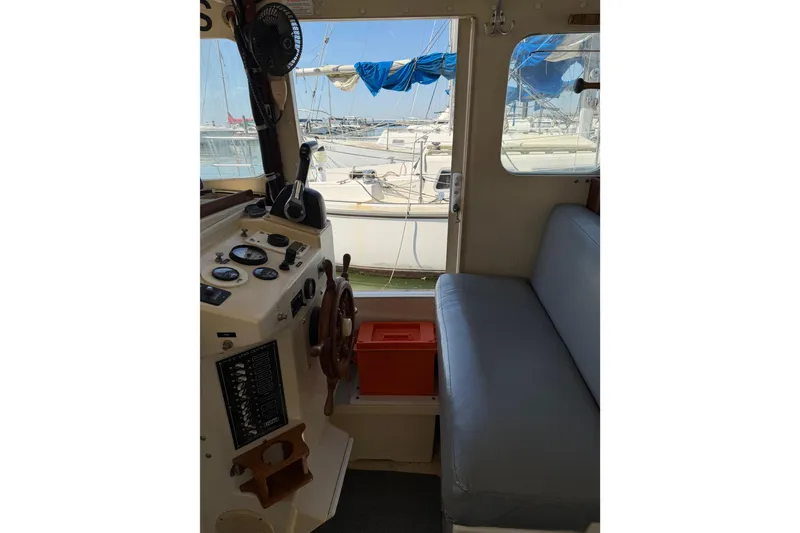 Slide: The Image of Interior of 1998 Rosborough RF-246 Sedan Cruiser with helm and seating area. - 43