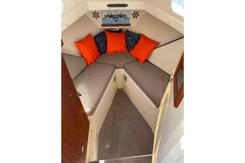 Slide: The Image of Cozy interior of 1998 Rosborough RF-246 Sedan Cruiser with vibrant cushions and nautical decor. - 44