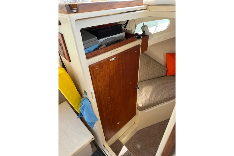 Slide: The Image of 1998 Rosborough RF-246 Sedan Cruiser interior with wooden cabinetry and seating area. - 45