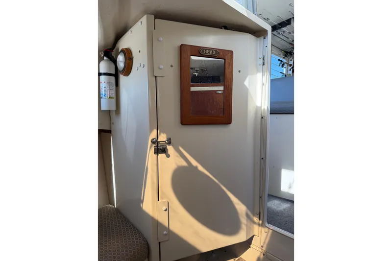 Slide: The Image of Interior of 1998 Rosborough RF-246 Sedan Cruiser showing cabin door and fire extinguisher. - 46