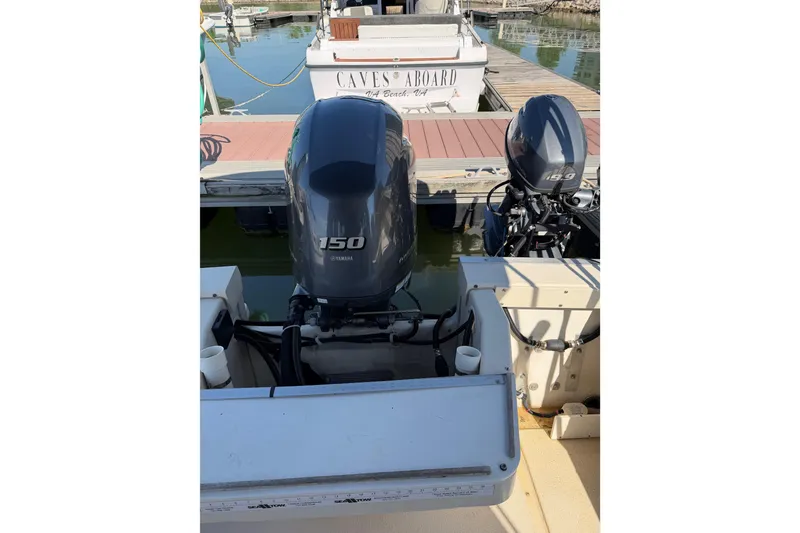 Slide: The Image of 1998 Rosborough RF-246 Sedan Cruiser with Yamaha outboard engines at dock. - 7