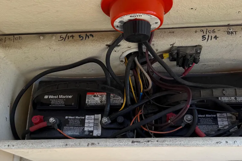 Slide: The Image of Battery compartment of a 1998 Rosborough RF-246 Sedan Cruiser with wiring and switch. - 9
