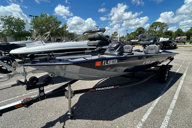 The Image of 2021 Tracker Pro Team 175 TF boat on trailer outdoors. - 0