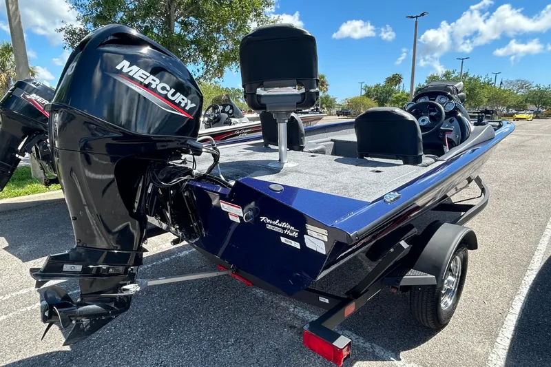 Slide: The Image of 2021 Tracker Pro Team 175 TF boat with Mercury engine in parking lot. - 3