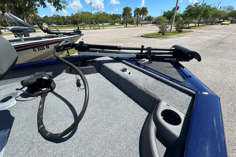 Slide: The Image of 2021 Tracker Pro Team 175 TF boat with Minn Kota trolling motor in parking lot. - 5