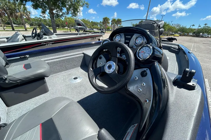 Slide: The Image of 2021 Tracker Pro Team 175 TF boat interior with steering wheel and gauges. - 8