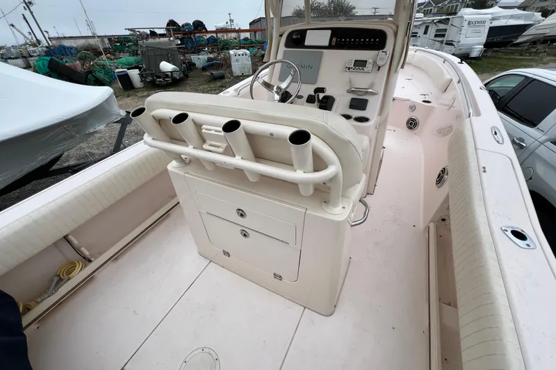 Slide: The Image of 2014 Grady-White Fisherman 230 boat interior with helm and rod holders. - 15