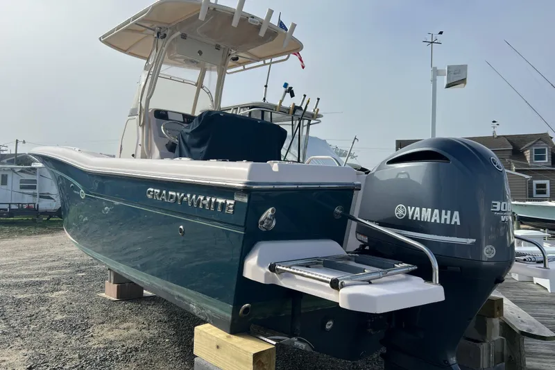 Slide: The Image of 2014 Grady-White Fisherman 230 boat with Yamaha 300 engine on display. - 2