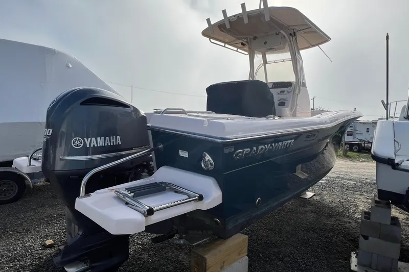 Slide: The Image of 2014 Grady-White Fisherman 230 boat with Yamaha engine, parked outdoors. - 3
