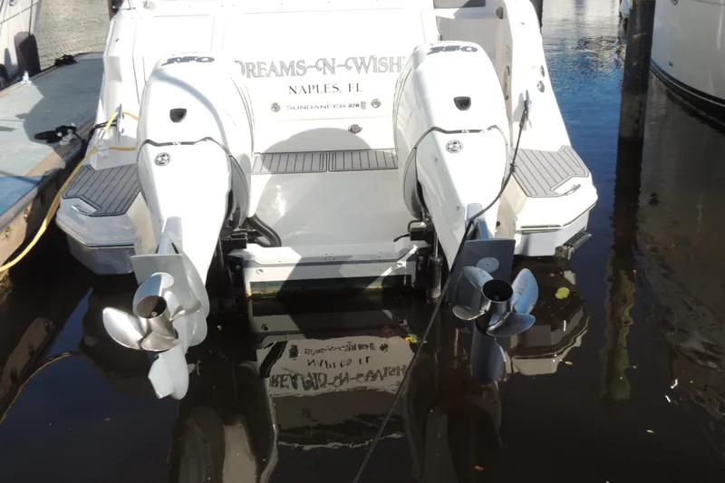 Slide: The Image of 2020 Sea Ray Sundancer 320 Outboard docked, featuring dual engines and sleek design. - 15
